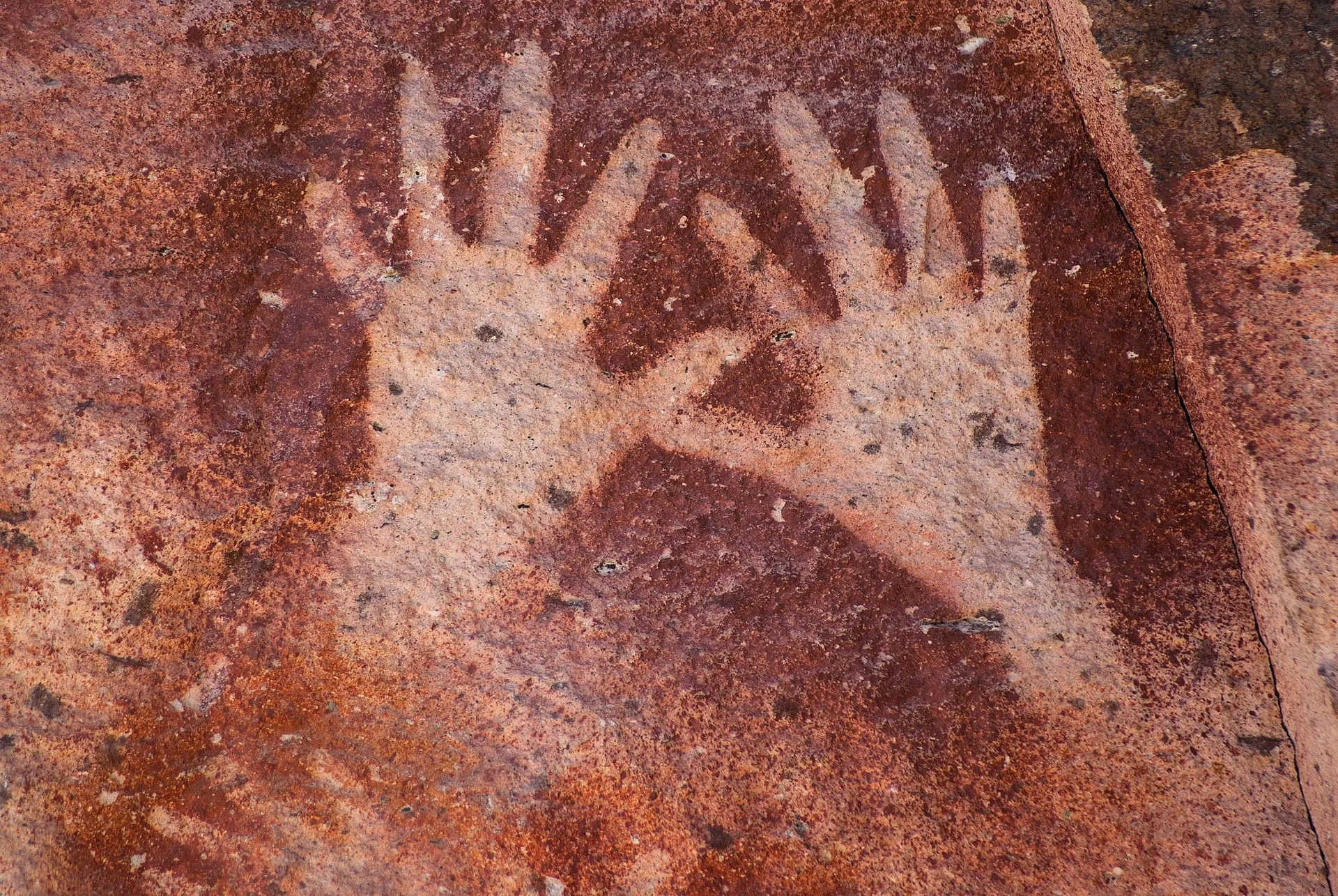 hands on cave walls